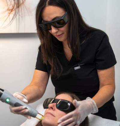 image of Laser 360 performing laser hair removal on a lady's face in Tampa, FL clinic.